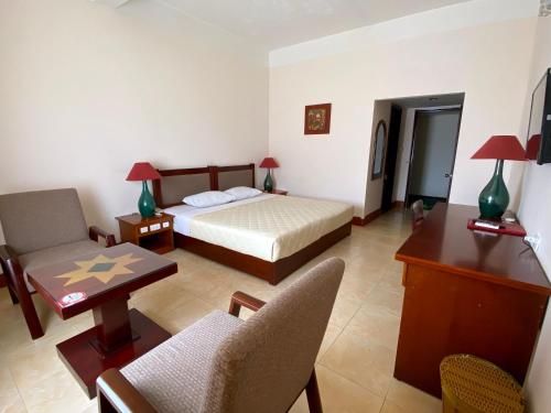 Ένα ή περισσότερα κρεβάτια σε δωμάτιο στο Dam San Hotel