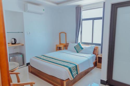Postel nebo postele na pokoji v ubytování Luxury hotel Phú Yên