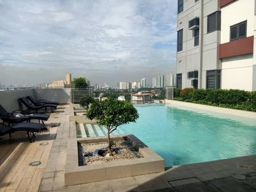 a swimming pool on the roof of a building at The Sentinel Residences in Manila
