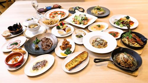a table full of plates of food on a table at ANA Holiday Inn Sendai by IHG in Sendai