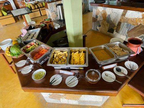 a table with many different types of food on it at Zion View Ella Green Retreat in Ella