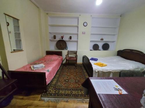 Cozy House I tesisinde bir odada yatak veya yataklar
