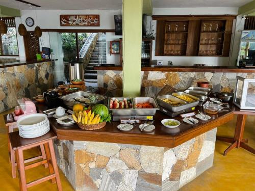 a kitchen counter with a bunch of food on it at Zion View Ella Green Retreat in Ella