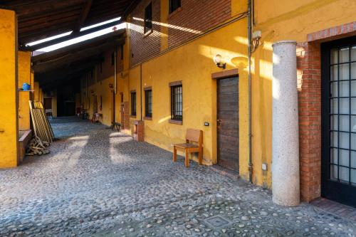 an empty hallway of a building with a bench next to it at Residence San Raffaele 1 in Milan