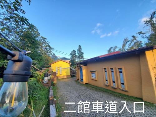 a street view of a house with a light at 墾丁牧場Villa Kenting Pasture - Villa B&B in Kenting