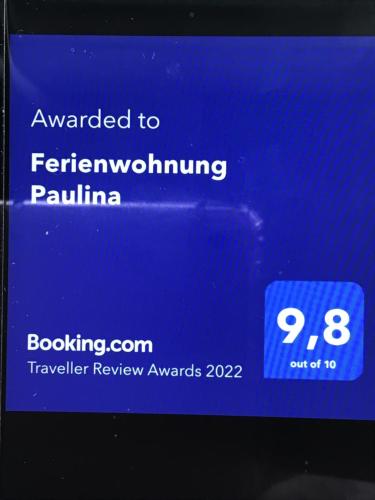 a cell phone screen with a sign that says awarded tofremoming palma at Ferienwohnung Paulina in Braunschweig