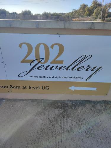 a sign for a building with the words renewal at BEACHFRONT with Seaviews Apartment No56 Award Winner Unbeatable Location for Closeness to the Sea Ideal for Guests looking for Winter Spring and Autumn Breaks in Sunny Malta Also Ideal for Coastal Hikers in Mellieħa