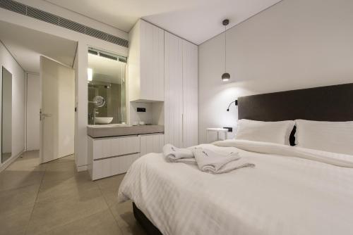 Posteľ alebo postele v izbe v ubytovaní Aqua Bay