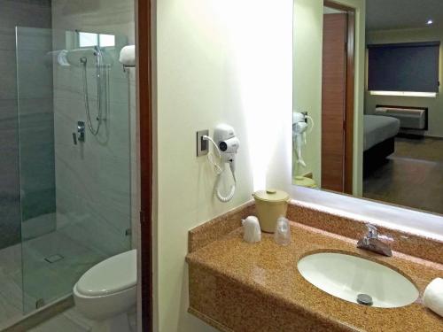 a bathroom with a sink and a shower at Comfort Inn Monterrey Norte in Monterrey