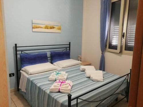 Кровать или кровати в номере Casa Pescoluse 50m dal Mare
