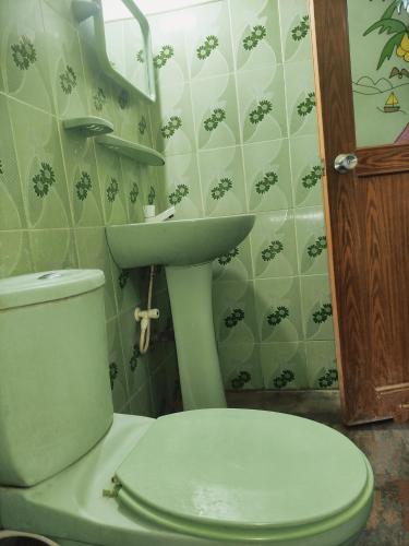 a bathroom with a toilet and a sink at Deer Garden Guest in Polonnaruwa