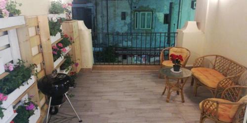a room with a table and chairs and a gate at La Terrazza della Nonna in Palermo