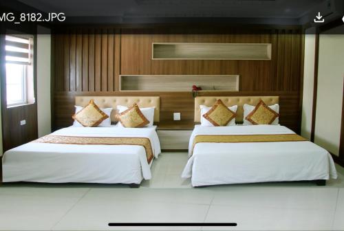 A bed or beds in a room at Victory Hotel, số 7, Vương Thúc Mậu, Tp Vinh