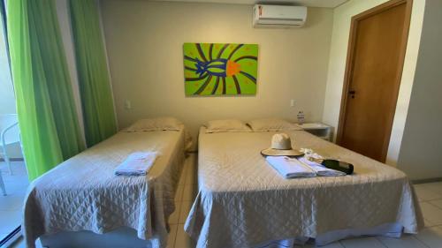 Tempat tidur dalam kamar di FLAT MARULHOS