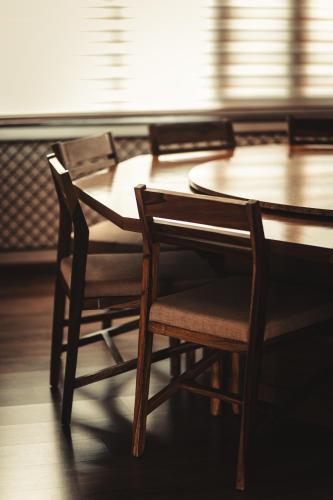 a table and chairs in a room with a table and chairsktop at Bhola Bhawan Bed and Breakfast in Jaipur