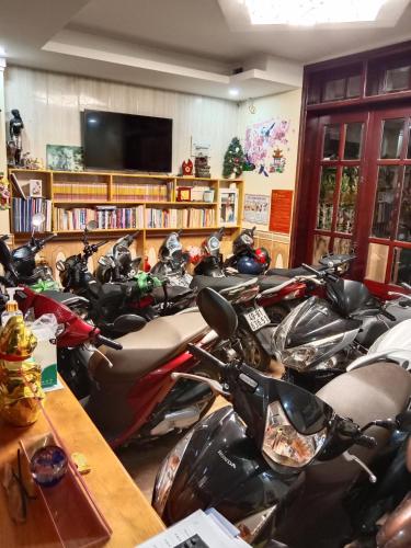 a bunch of motorcycles parked in a room at Nón Lá Guest House in Da Lat