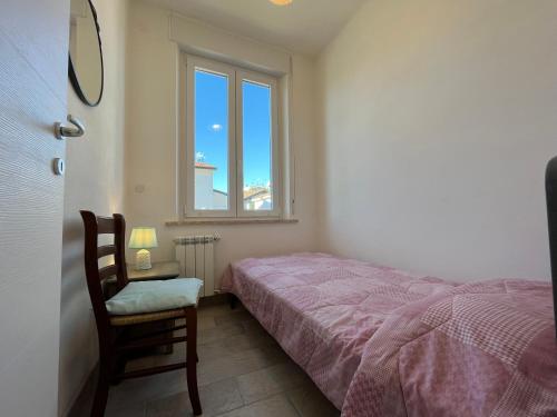 Letto o letti in una camera di Casa Genny