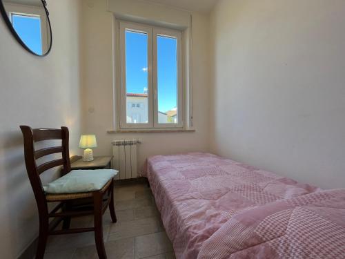 Letto o letti in una camera di Casa Genny