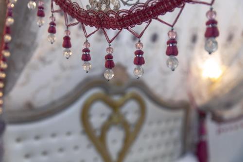 a close up of a necklace with a heart at Studio Romantique Maison de L'église du Couvent in Narbonne