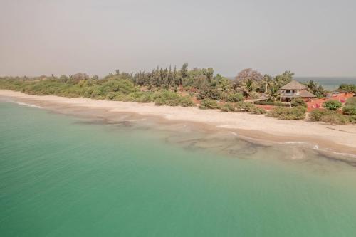 an aerial view of a beach with a house at la villa sur la plage in Palmarin
