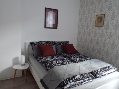 Postel nebo postele na pokoji v ubytování Ferienwohnung Mittendrin mit Parkplatz