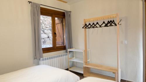 Ένα ή περισσότερα κρεβάτια σε δωμάτιο στο Balcón de Pineta