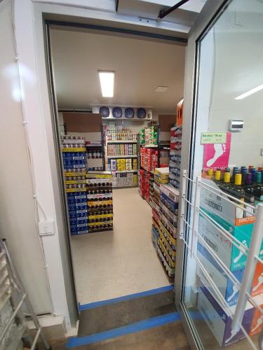 a aisle of a store with a door open at Sundre Motor Inn in Sundre