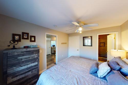 a bedroom with a bed and a ceiling fan at Crazy Horse Condo in Edwards