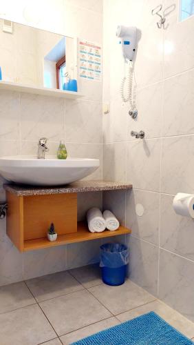 a bathroom with a sink and a mirror at IstraNova Apartments in Rovinj