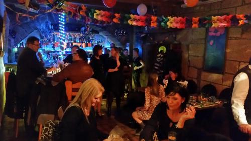 a group of people sitting in a bar at Hotel Restaurant Klostermühle in Reutlingen
