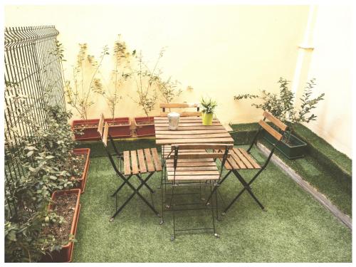 a wooden table and chairs on a patio at Estudio Príncipe David - VUT in Toledo