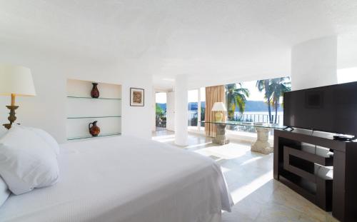 Cama o camas de una habitación en Maravillosa casa con 7 habitaciones, acceso directo a playa pichilingue, bahía de puerto marqués, zona diamante Acapulco