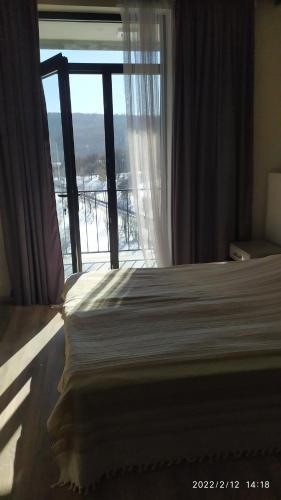 Ένα ή περισσότερα κρεβάτια σε δωμάτιο στο Kechi House AM