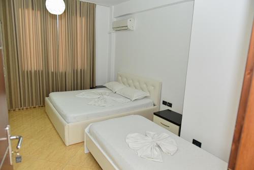 Postel nebo postele na pokoji v ubytování Hotel Tomorri