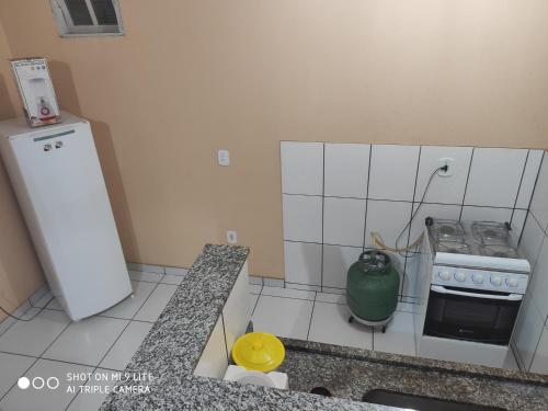 Kuchyň nebo kuchyňský kout v ubytování Kitnets Coroa vermelha Coroa