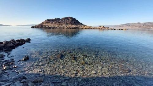 a small island in the middle of a body of water at Casa al mare in Sveti Juraj