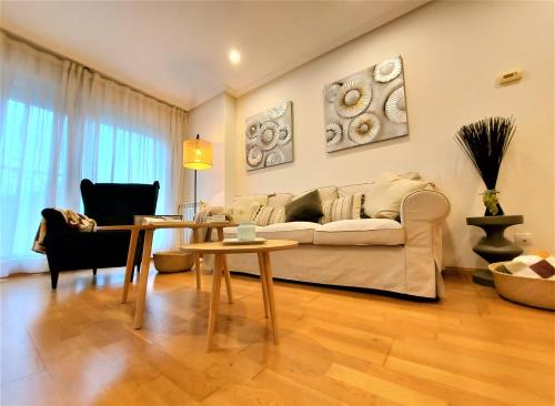 a living room with a couch and a table at LA CASA DE CRISTINA Y NEREA - RIBADESELLA in Ribadesella