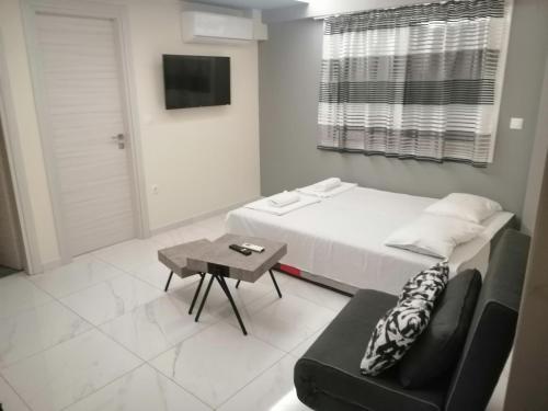 Ένα ή περισσότερα κρεβάτια σε δωμάτιο στο Premium apartman Family