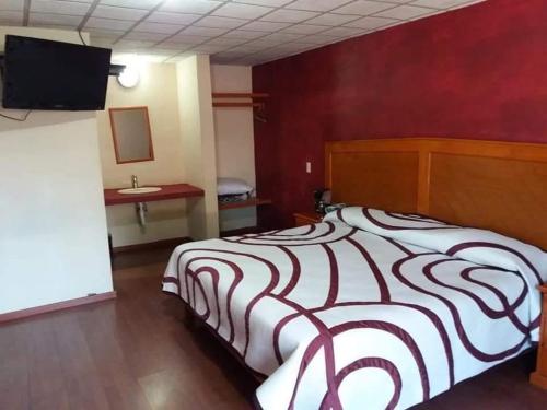 Postel nebo postele na pokoji v ubytování HOTEL RESTAURANT LOS PRISMAS