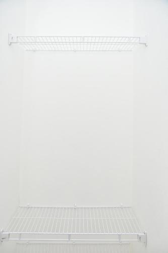 a row of solar panels on a white wall at Apartamento en Juan Dolio Tepuy 501 B in Juan Pedro