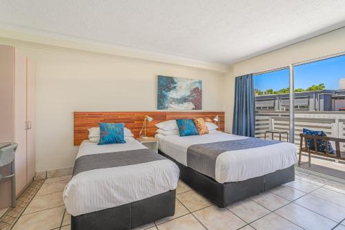 Ένα ή περισσότερα κρεβάτια σε δωμάτιο στο Nelson Towers Motel & Apartments