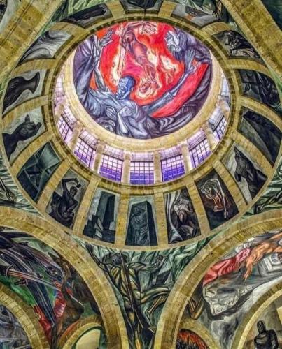 a ceiling of a building with paintings on it at Tu joya y Tu Perla Tapatia - AC, alberca, Gym apartamento en el corazón de Guadalajara in Guadalajara