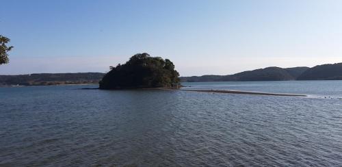 an island in the middle of a body of water at Ikijimaso in Iki