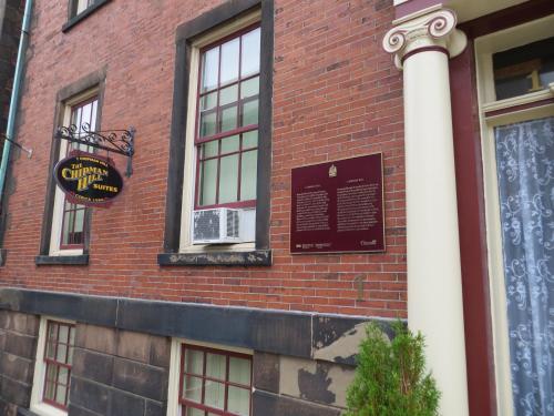 a brick building with a sign on the side of it at Chipman Hill Suites - Union Street in Saint John