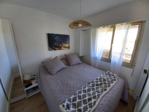 Ένα ή περισσότερα κρεβάτια σε δωμάτιο στο appartement vue sur mer