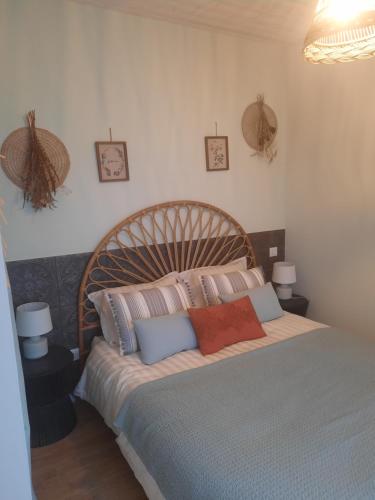 a bedroom with a large bed with pillows on it at Le clos du coteau in Vendeuvre-du-Poitou