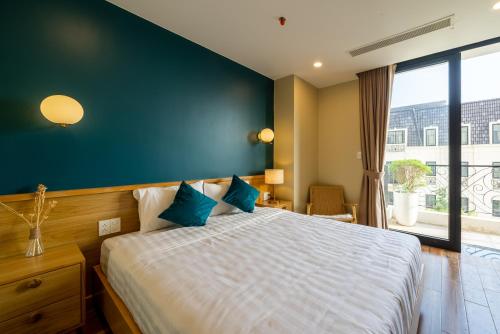 Postel nebo postele na pokoji v ubytování Sline Hotel and Apartment