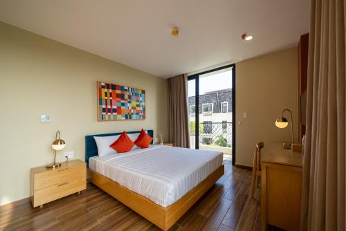 Postel nebo postele na pokoji v ubytování Sline Hotel and Apartment