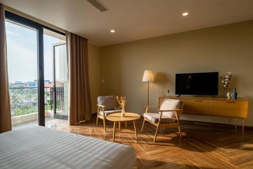 TV a/nebo společenská místnost v ubytování Sline Hotel and Apartment
