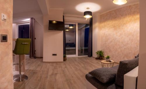 a living room with a couch and a tv on a wall at Villa Ragusa in Dubrovnik